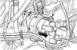 Расположение болтов (1) крепления распределителя зажигания (2) и метки (а) совмещения на корпусе и кожухе распределителя зажигания